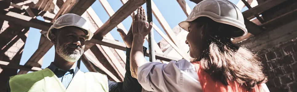 construction manager congratulating a member of his field crew