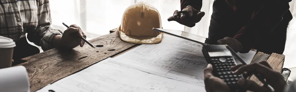 contractors looking over real-time data reports from their contractor time tracking software